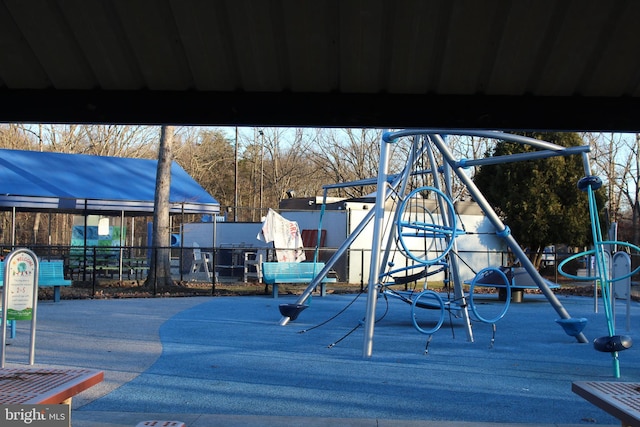 communal playground featuring fence