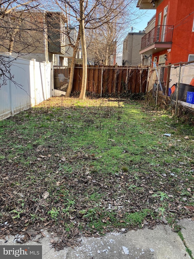 view of yard with a fenced backyard