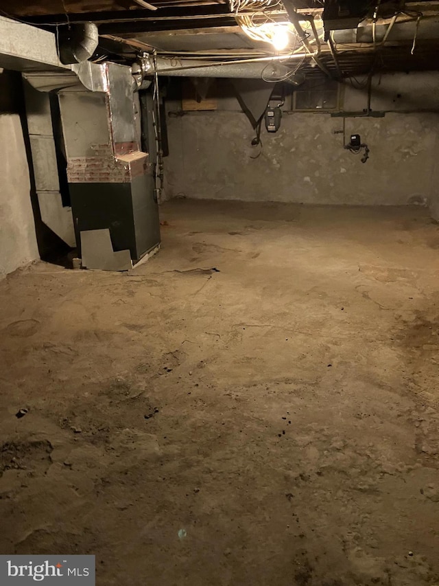 unfinished basement with heating unit