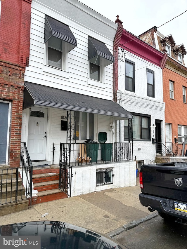 view of property with covered porch