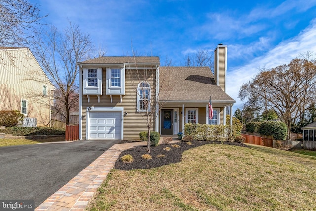 view of front of home featuring a front lawn, fence, aphalt driveway, a chimney, and a garage