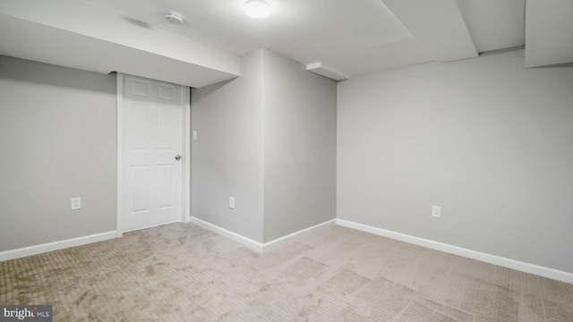 basement with light colored carpet