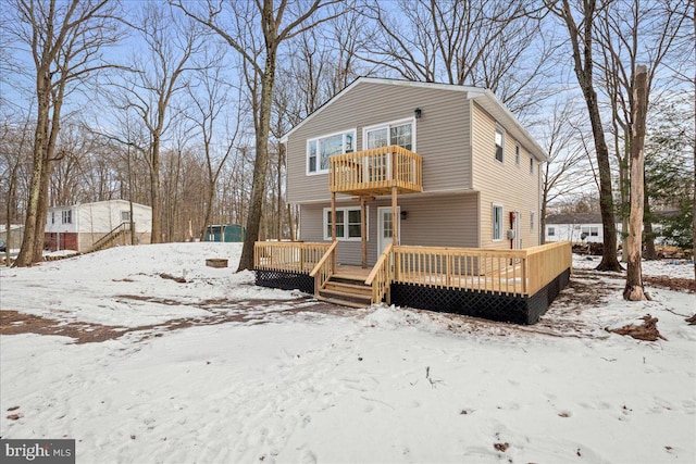 view of front of home featuring a balcony and a deck