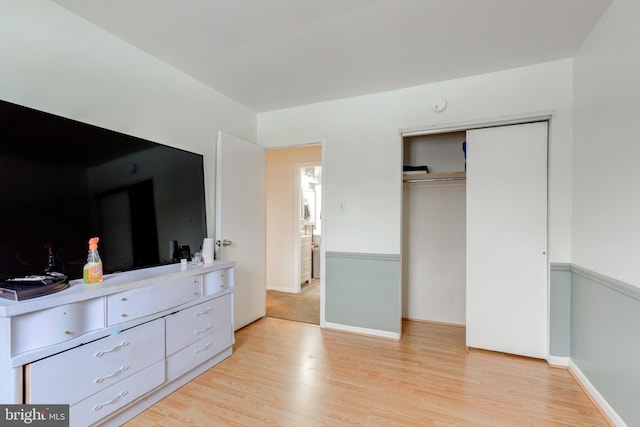 bedroom featuring a closet and light hardwood / wood-style flooring