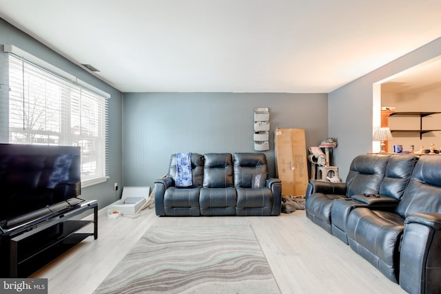 living room with light hardwood / wood-style floors