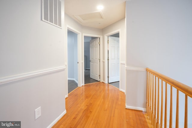 corridor with wood-type flooring