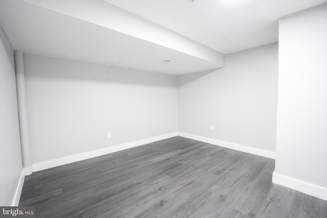 basement featuring dark wood-type flooring