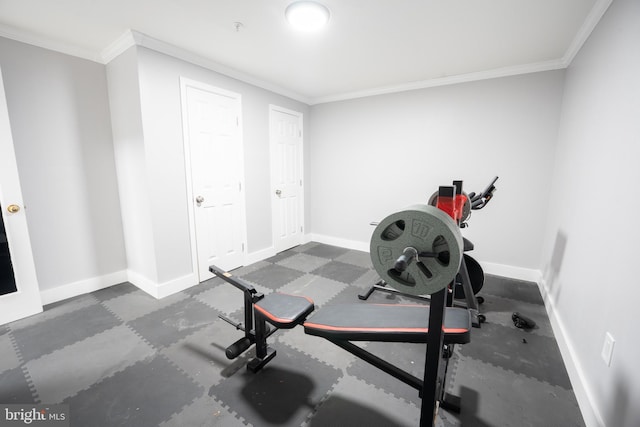 workout room with ornamental molding