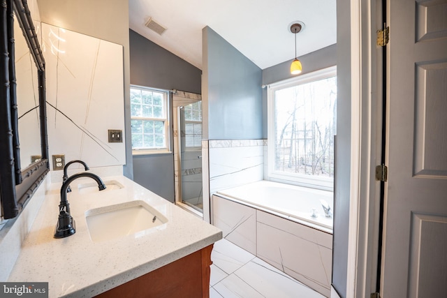 bathroom with shower with separate bathtub, lofted ceiling, and vanity