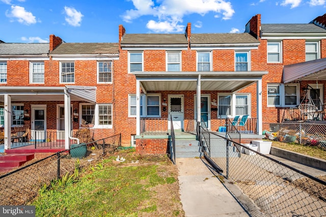 townhome / multi-family property featuring a porch