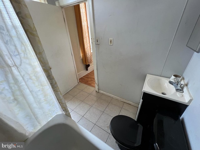 bathroom featuring tile patterned flooring and vanity