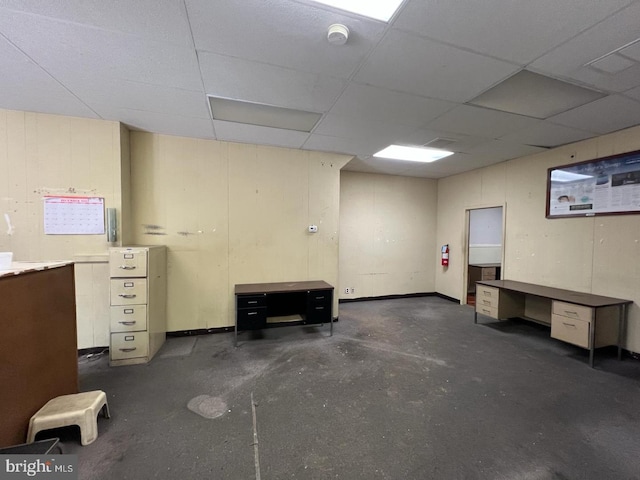 basement featuring a drop ceiling