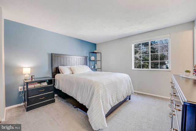 carpeted bedroom with a textured ceiling