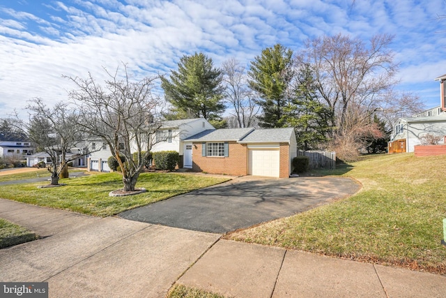 single story home featuring a front yard and a garage