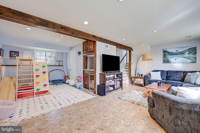 living room featuring beamed ceiling