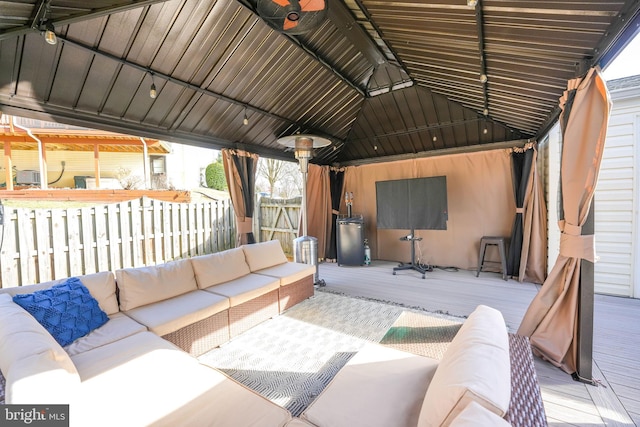 view of patio / terrace with outdoor lounge area, a deck, and a gazebo