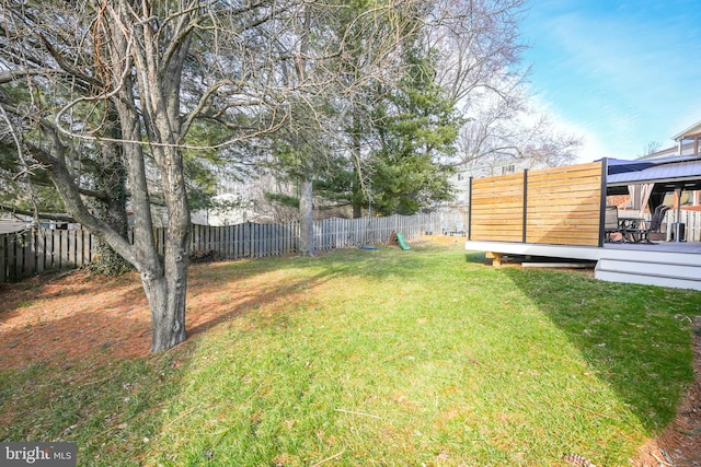 view of yard with a deck