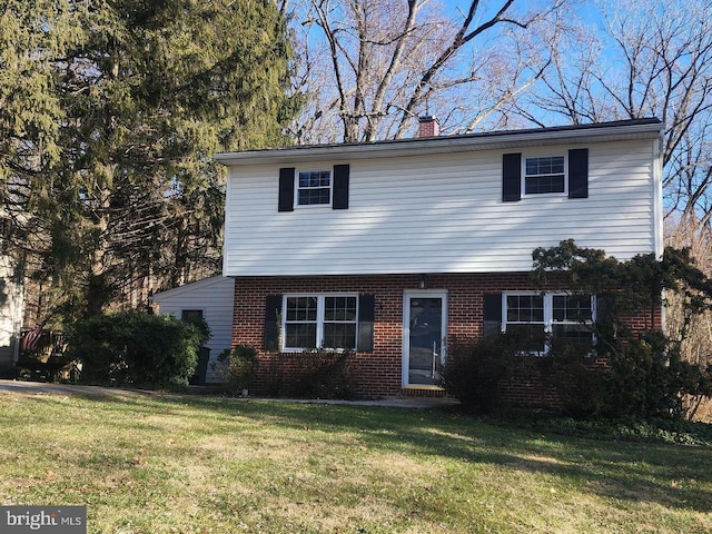 front facade with a front yard