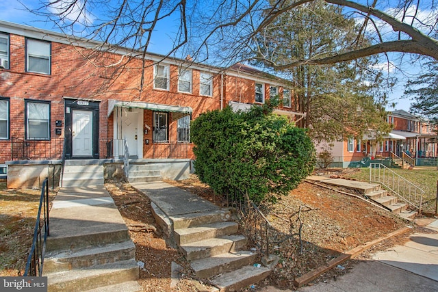 view of property with brick siding