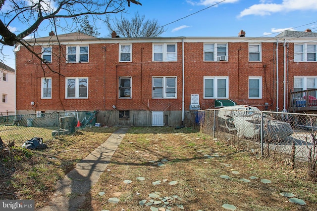 view of property with fence