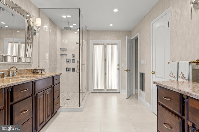 bathroom featuring recessed lighting, visible vents, a stall shower, vanity, and tile patterned flooring