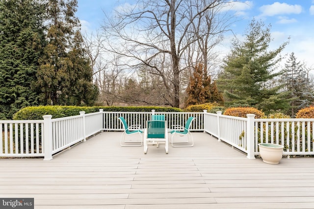 wooden terrace with outdoor dining area