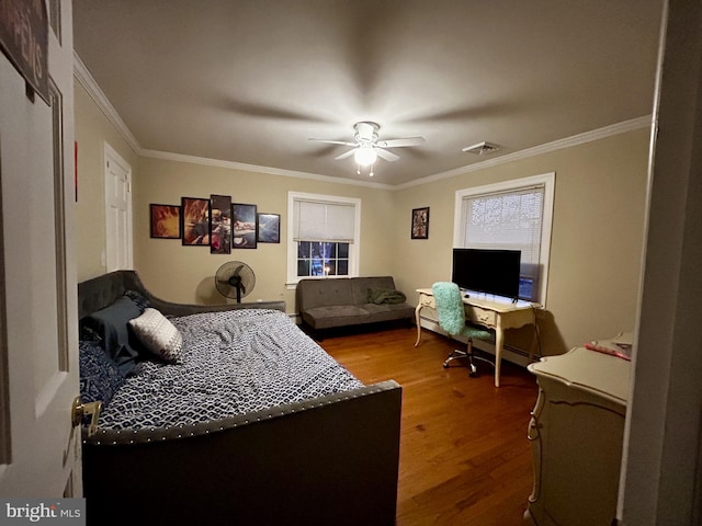 bedroom featuring crown molding, hardwood / wood-style floors, and ceiling fan