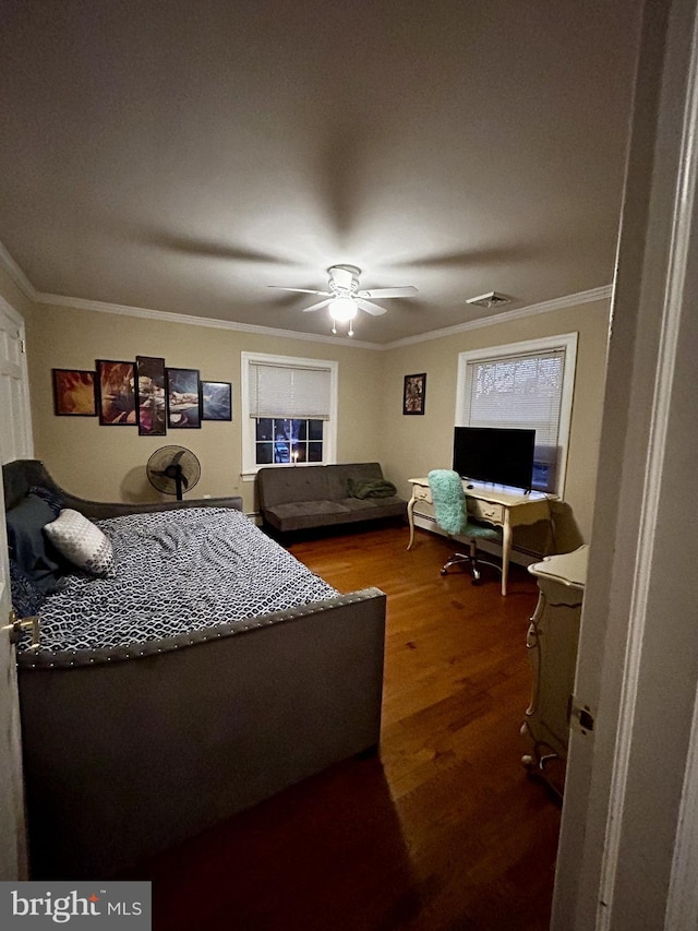 bedroom featuring crown molding, wood-type flooring, and ceiling fan