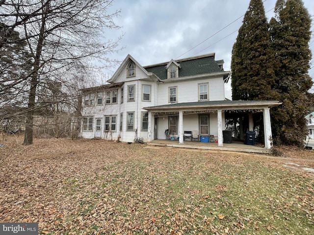 back of house with a porch