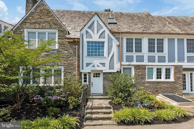 view of front of house with stone siding and stucco siding