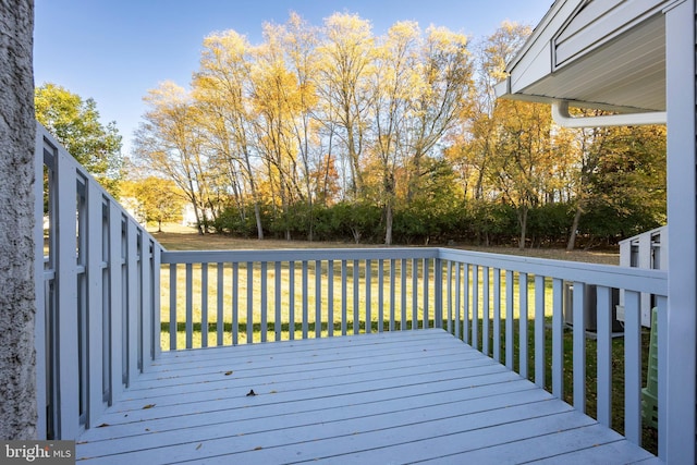 wooden deck with a yard