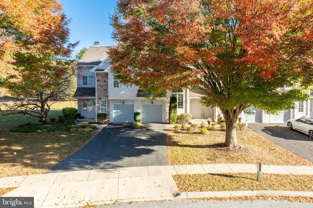 obstructed view of property featuring a garage