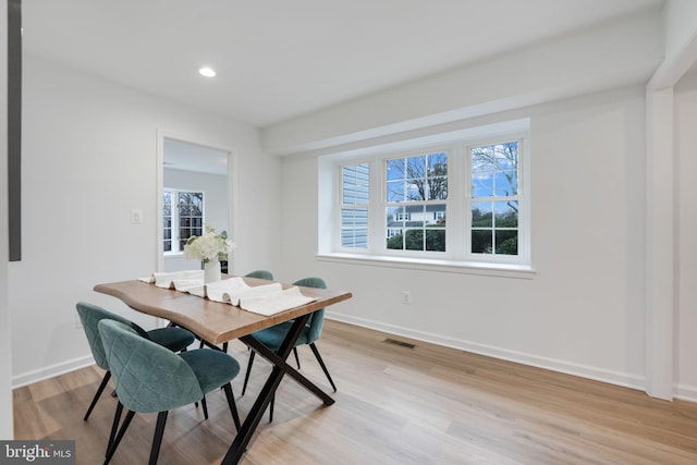 dining area featuring light wood-type flooring, visible vents, baseboards, and recessed lighting