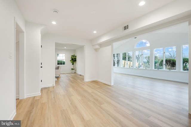 spare room with baseboards, visible vents, recessed lighting, and light wood-style floors