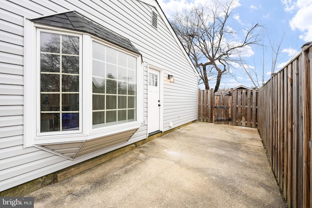 view of patio featuring fence