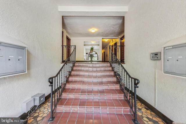 stairway featuring mail boxes