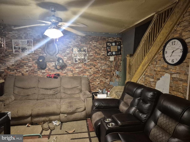 unfurnished living room featuring ceiling fan