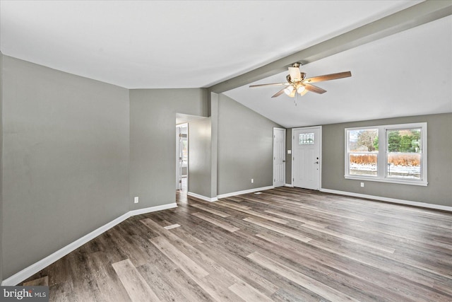 unfurnished living room with wood-type flooring, ceiling fan, and vaulted ceiling