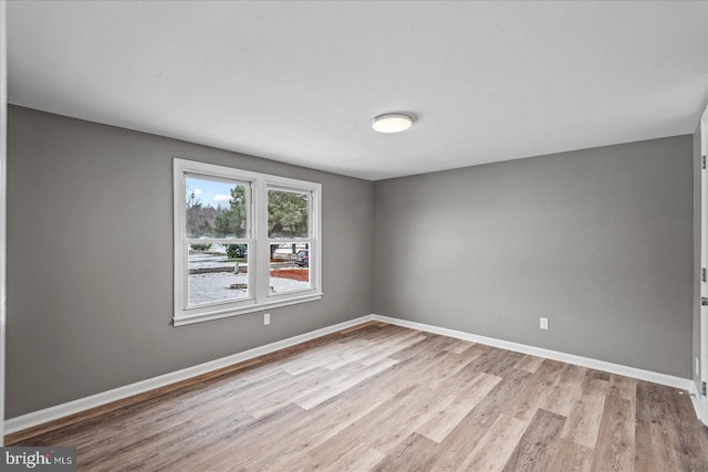 unfurnished room featuring light hardwood / wood-style flooring