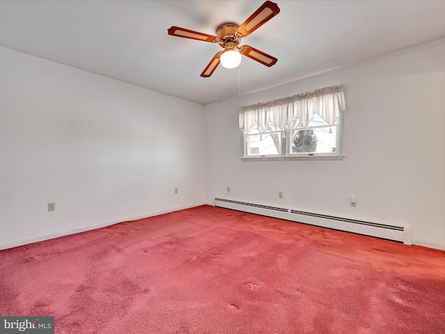 carpeted spare room with ceiling fan and a baseboard radiator