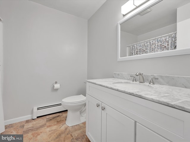 bathroom featuring toilet, baseboards, a baseboard heating unit, and vanity