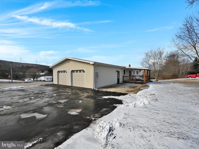 exterior space featuring a garage and covered porch