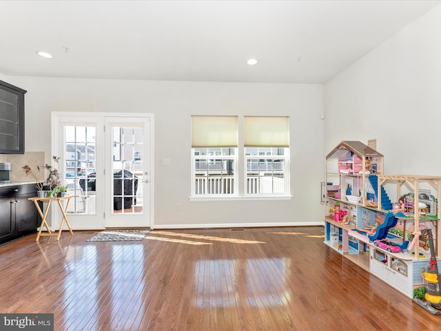 doorway to outside with dark wood-type flooring