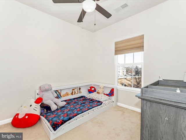 carpeted bedroom with ceiling fan