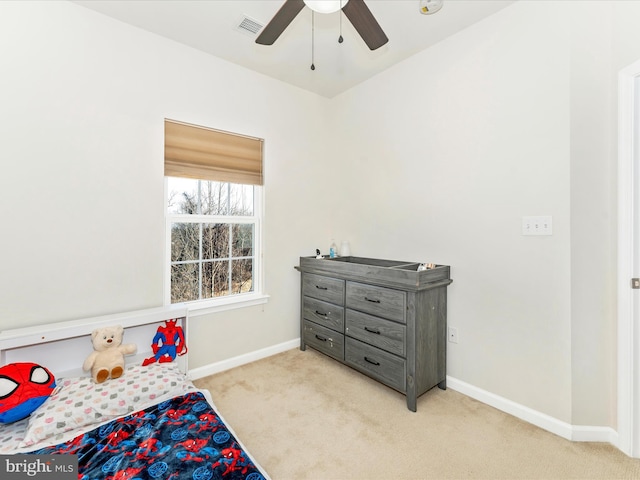 bedroom with ceiling fan and light colored carpet