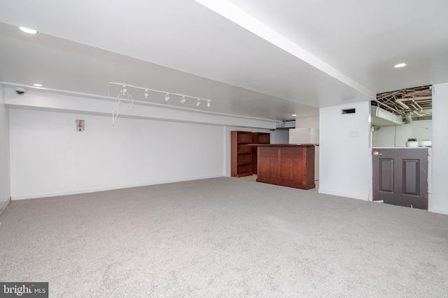 unfurnished living room with bar and carpet