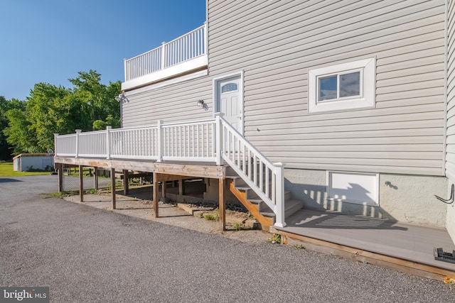 entrance to property with a deck