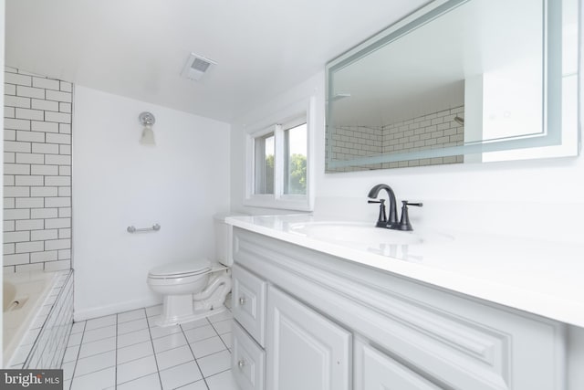 bathroom featuring tile patterned flooring, vanity, and toilet