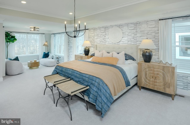 carpeted bedroom with crown molding and a notable chandelier