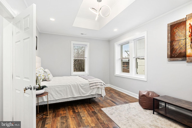 bedroom with multiple windows, crown molding, and dark wood-type flooring